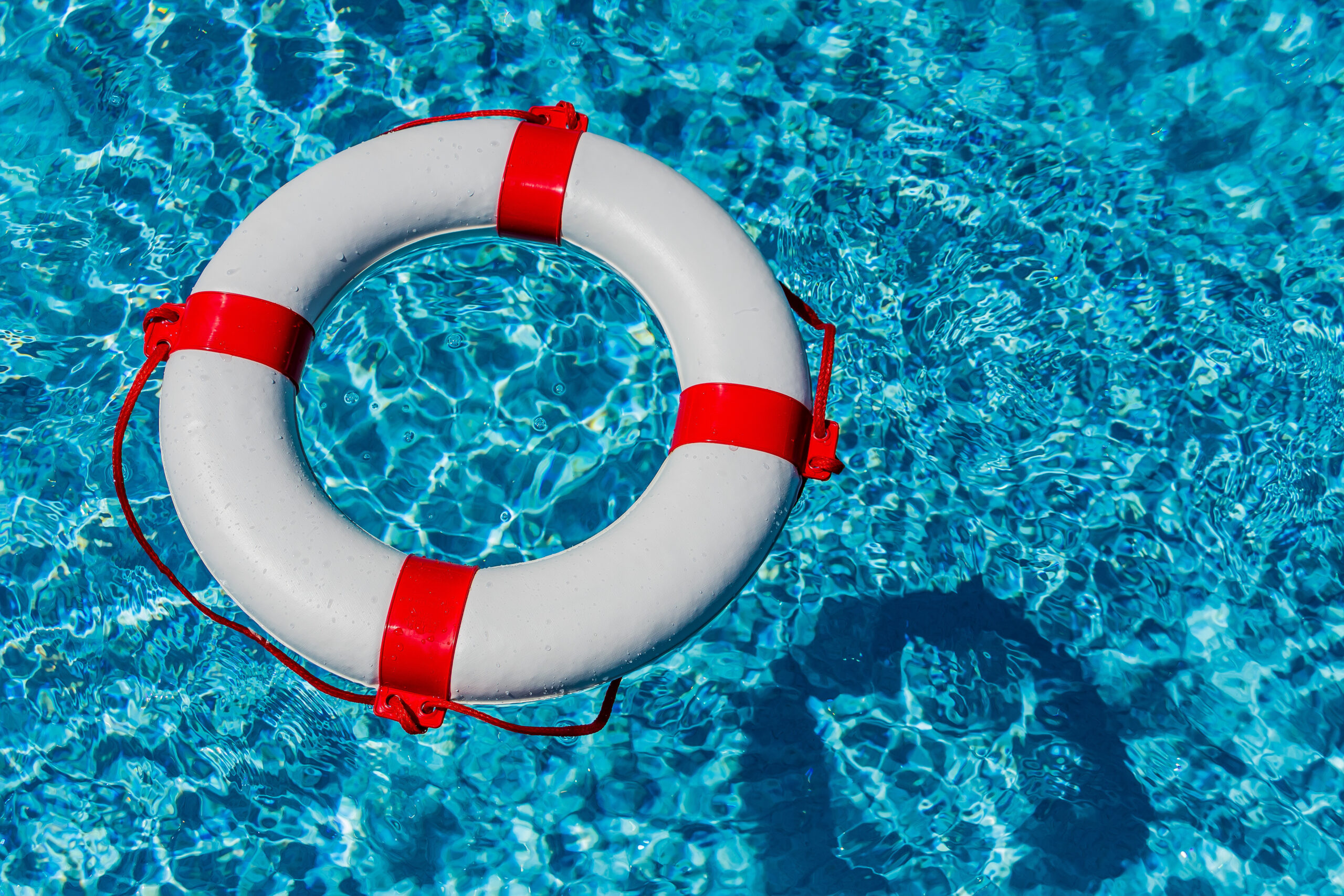 an,emergency,tire,floating,in,a,pool.,symbolic,photo,for